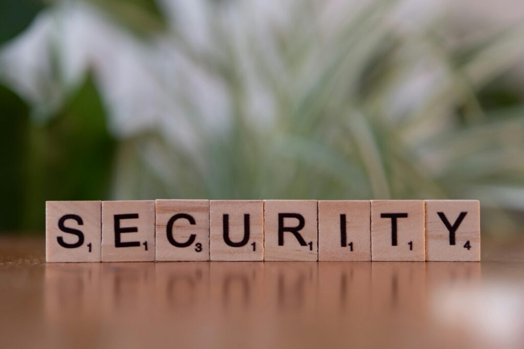 Privacy Policy Close-up of wooden Scrabble tiles spelling SECURITY, symbolizing cybersecurity and protection.